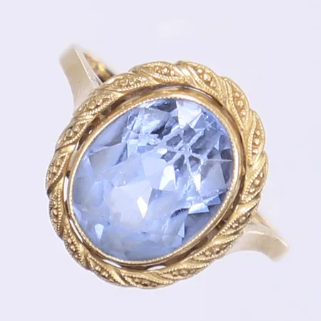Ring med syntetisk blå spinell stl:16 böjd skena 18K Vikt: 3,6 g