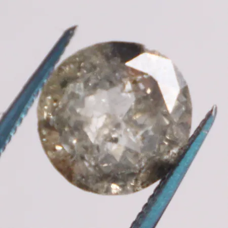 1 lös diamant ca: 2,5ct yellow- brown/P3 skada på rondisten 