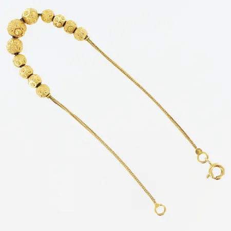 Armband mönstrade kulor längd 18,5cm bredd 1-6mm 21K. Vikt: 5,4 g