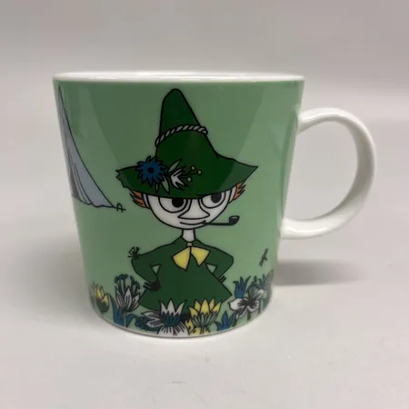 Muminmugg Snufkin (2016-), Moomin Arabia, höjd 8cm, Ø8cm. Skickas med paket.