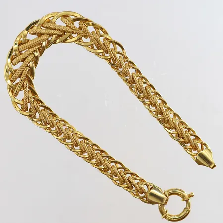 Armband med dekor längd 19cm bredd 7,5-11mm 21K. Vikt: 10,9 g