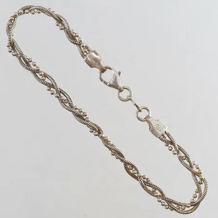 Armband flätad längd 18,5cm bredd 4mm Silver 925/1000.  Vikt: 6 g