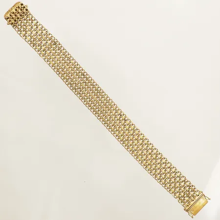 Armband X-länk längd 20,5cm bredd 17,6mm tillverkad av Stockholms Ädelsmide Ab år 1962 18K Vikt: 34,2 g