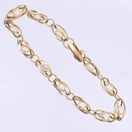 Armband med pärlor 18,5cm bredd 6mm 18K Bruttovikt: 9,4g 