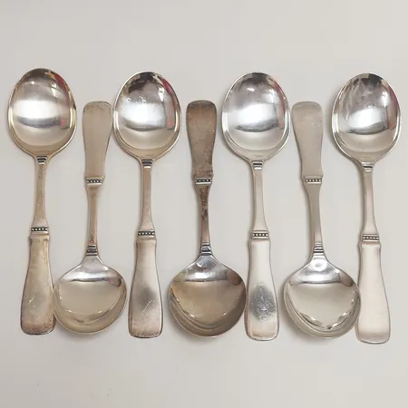 Sju skedar längd 15,5cm, modell Uppsala, silver 830/1000 Vikt: 227,5 g