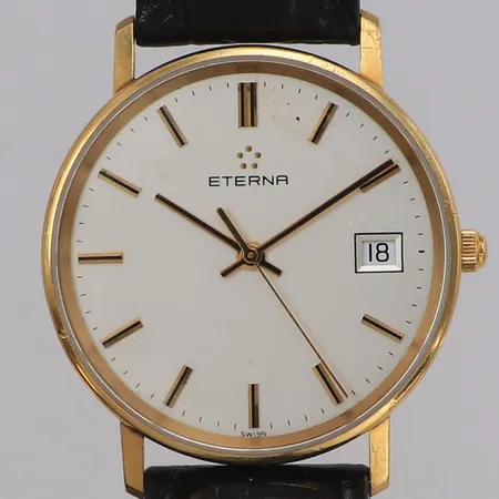 Armbandsur Eterna 18K, quartz, 33,5mm, nr 4100.68, datum, gravyr, skadad urtavla, läderarmband ej original, inga tillbehör.