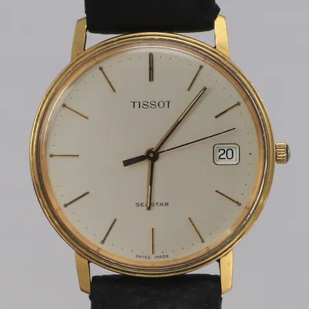 Armbandsur Tissot boett 18K, 33mm, läderarmband längd inklusive ur ca 19cm, defekt krona, står still, gravyr