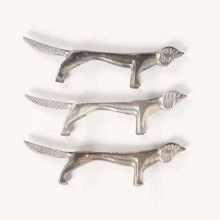 Tre smörhundar, 24x14x88mm, metall.