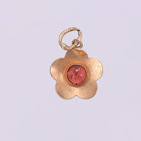 Hänge blomma med sten, längd 16,4mm bredd 10,5mm. 18K  Vikt: 0,6 g