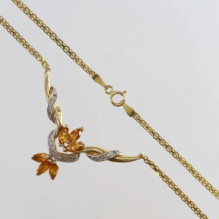 Collier med gula stenar och diamanter 15 x 0,01ct längd 43cm bredd 2-27,5mm skadad vid fästning 14K Vikt: 7,2 g
