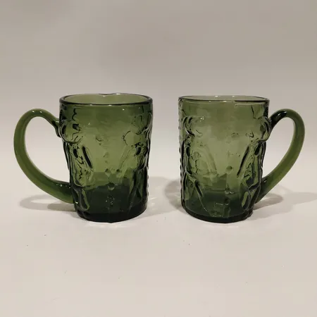 Två sejdlar "Adam och Eva" Erik Höglund Boda Glasbruk höjd 11cm Ø8cm grön glasmassa Skickas med paket.