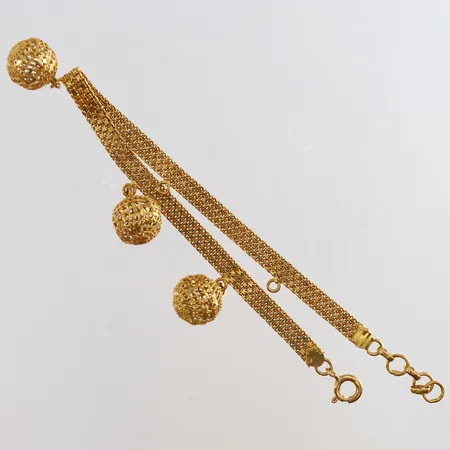 Armband X-länk med tre berlocker längd 18,5-19,5cm bredd 4-10mm två berlocker saknas 21K. Vikt: 8,6 g