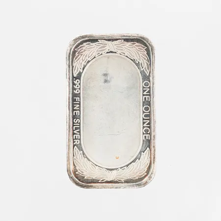 Silvertacka one ounce, emaljdekor av amerikanska flaggan, längd 50mm, bredd 29mm, silver 999/1000 Vikt: 32,3 g