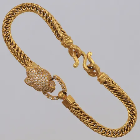 Armband Rävsvans med dekor av panterhuvud med vita och röda stenar, längd ca 17cm, bredd mm, Thaiguld, 1 baht, 23K Vikt: 15,2 g