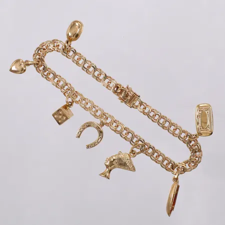 Armband Bismarck med 7 berlocker längd: ca 20cm bredd: ca 5mm-28mm Nordiska Guldvaru-Aktiebolaget år 1955 18K Vikt: 16,5 g