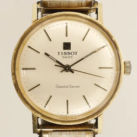 Herrur Tissot Seastar Seven guld manuell Ø33mm flexilänk repor krona gulmetall gravyr 18K på boetten.