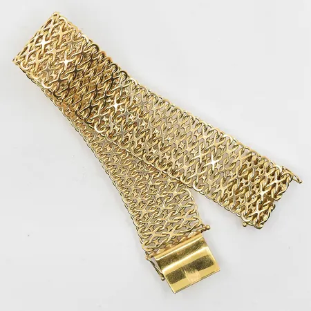 Armband halvstel modell längd 19½cm, bredd 21mm, 18K. Vikt: 42 g