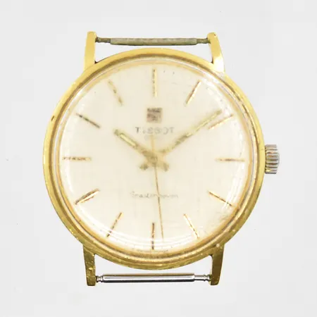 Herrur Tissot Seastar Seven 18K, manuell, Ø34mm, defekt uppvridning/går ej, mycket repigt plexiglas, graverad bakboett, inga tillbehör. Bruttovikt 25,7g.