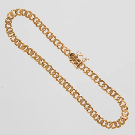 Armband Pansar längd: 20,2cm, bredd: 4,5mm, svenska stämplar, säkerhetskedja saknas, något ojämna länkar, 18K Vikt: 9,5 g