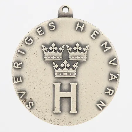 Hänge "Sveriges Hemvärn Sydkrafts Driftvärn", längd 37mm, bredd Ø33mm, saknar ögla, silver 925/1000 Vikt: 19 g