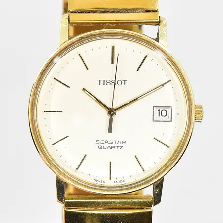 Herrur Tissot Seastar 14K, quartz, Ø34mm, datum, flexband i doublé, trög krona, graverad bakboett, inga tillbehör. Bruttovikt 49,0g.