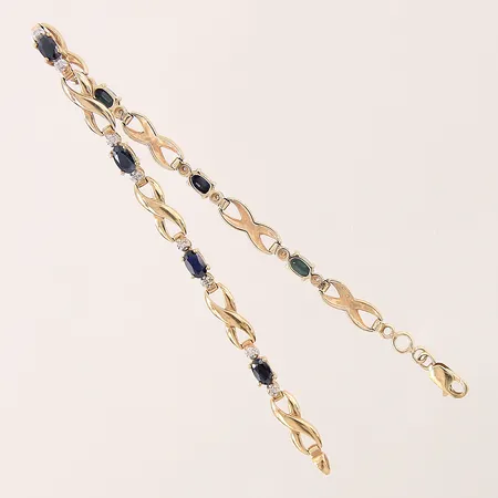 Armband med diamanter 14 x ca 0,005ct samt safirer, längd 18cm, bredd 3-4,5mm, 9K Vikt: 6,3 g