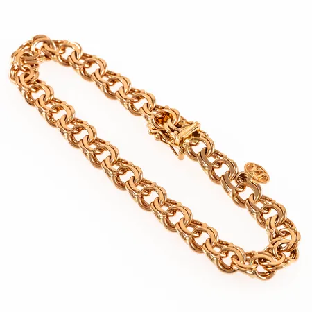 Armband Bismarck i 18K guld. Det är 18,5 cm långt, 7,5 mm brett och väger 18,8g. Mycket fint skick. Kistlås. Stämplad JO'ANS (Jo-Ans Guld AB, Köping), 750.