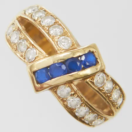 Ring med blå syntetiska spineller samt vita stenar, stl18½, bredd 4-12mm, repig, 14K, bruttovikt: 5,5g.