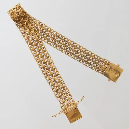 Armband X-länk, längd ca 19,5cm, bredd 11,5mm, 18K Vikt: 23,9 g
