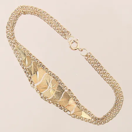 Armband, längd: 18,5cm, bredd: 4,6-15,2mm, något skeva länkar, 18K  Vikt: 5,7 g