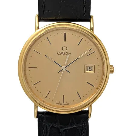 Herrur Omega Seamaster, 18K guld, Ø32,5 mm, quartz - behov av nytt batteri, datum, bruksmärken, original skinnband och spänne - skinnband med visst slitage Vikt: 33 g