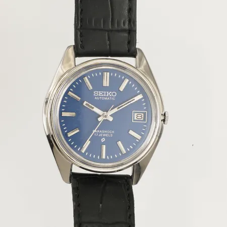 Armbandsur Seiko Parashock automatic, Ø37mm, datum, stål, referensnummer: 70055-8020 serienummer: 9N07108, färgrester på index, skadad urtavla, repiga visare, repig,  inga övriga tillbehör 
