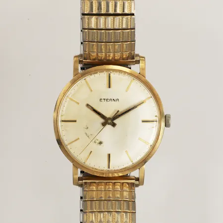 Armbandsur Eterna, 14K, manuell, Ø33mm, repigt plexiglas, utbytt krona, skadad urtavla, gravyr, flexarmband i stål, 