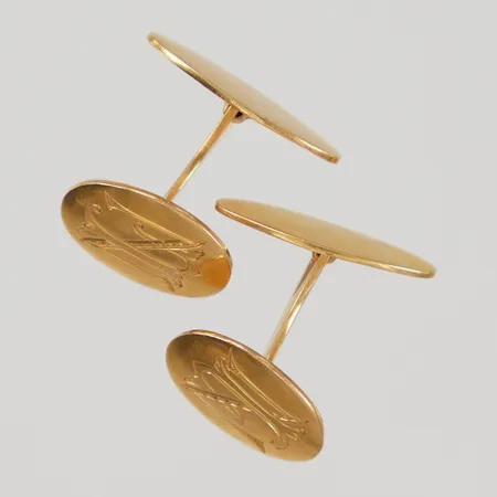 Ett par manschettknappar ca 16x11,8mm, monogram, 18K, Vikt: 7,4 g