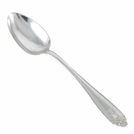 En kaffesked i silver. Modell Vasa, längd 131 mm, vikt 17,3g. Gravyr. 