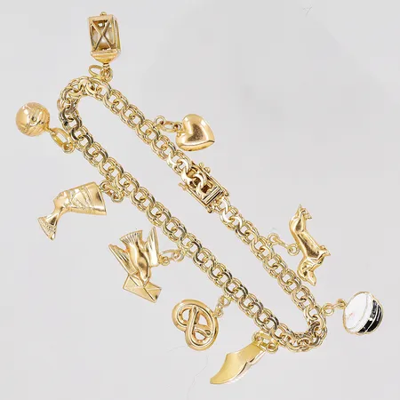 Armband Bismarck 18cm, bredd 4,8mm, 9st berlocker, 18K Vikt: 16,2 g