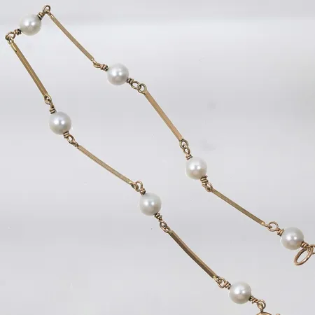 Armband med pärlor 18k 4,8g längd 21cm bredd 1mm-5,7mm
