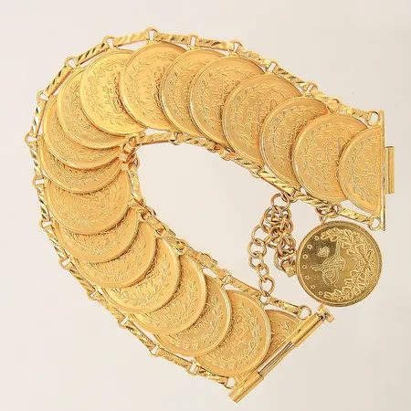 Armband med integrerade mynt, längd ca 18cm, bredd 26mm, 21K Vikt: 152,3 g