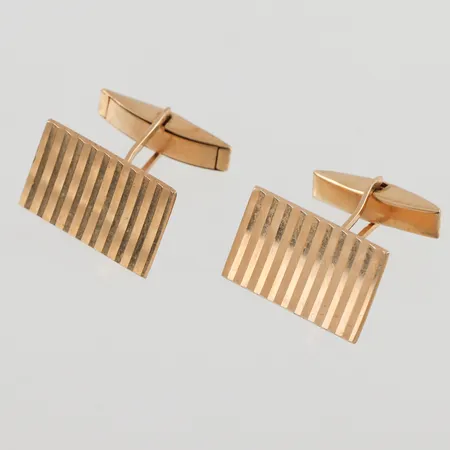 Ett par manschettknappar 20x12mm, ojämnhet, 18K, 8,0g.