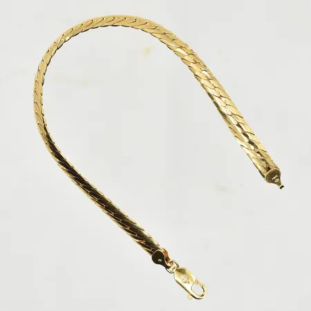 Armband halvstel modell, längd 19½ cm, bredd 6 mm, 18K. Vikt: 14,4 g