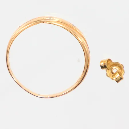 Parti guld defekt 18k Vikt: 2,4 g