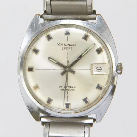 Herrur Chronica Sport, stål, manuell, 34mm, boettnr 7017, mineralglas, datum, flexarmband i stål, gravyr, repor, slitage, inga tillbehör. 