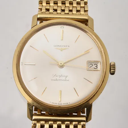 Herrur Longines Surfing, automati, Ø35mm, 18K guld med integrerad länk, datum, handledsmått inklusive ur ca 21cm, bruttovikt 81,2g, ca nettovikt 60g, etui.