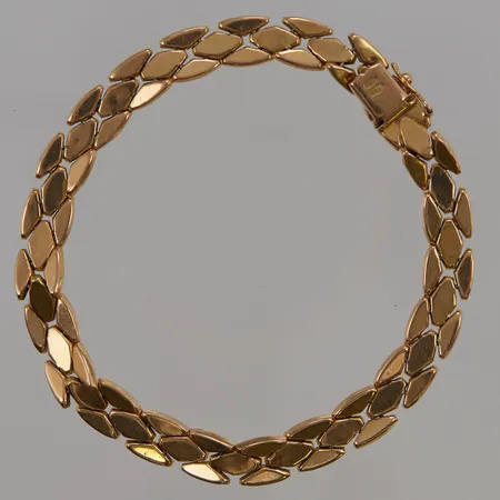 Armband 20,5cm, bredd:8mm, sliten/ojämn, 18K 15,5g.