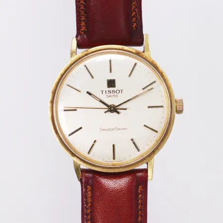 Herrur Tissot Seaster seven, Ø34mm, manuell, 18K, brunt läderband, repigt glas, lås defekt av, bruttovikt 34,7gram Vikt: 0 g