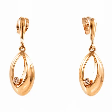 Hängande örhängen i 18K guld med vita stenar. De är 8 mm breda, 24,5 mm långa och väger 1,3g. 