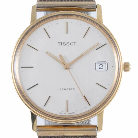 Herrur Tissot Seastar i 18K guld med band i metall. Boett Ø 33,5 mm, datumvisare, quartz, enstaka repor på plexiglas, gravyr. Går ej - Batteribyte krävs?