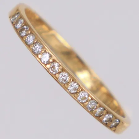 Halvalliansring med diamanter 14xca0,01ct, stl 17¼, bredd 1,8mm, Heribert Engelbert AB, år 1983, gravyr, 18K  Vikt: 1,4 g