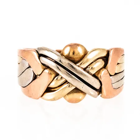 Ring FN/Pussel i trefärgat 14K guld. Den är i storlek 20¾, är 5,5 - 13 mm bred och väger 10,8g. Stellödd (går ej att pussla ihop/isär), märken/repor. Stämplad 585.