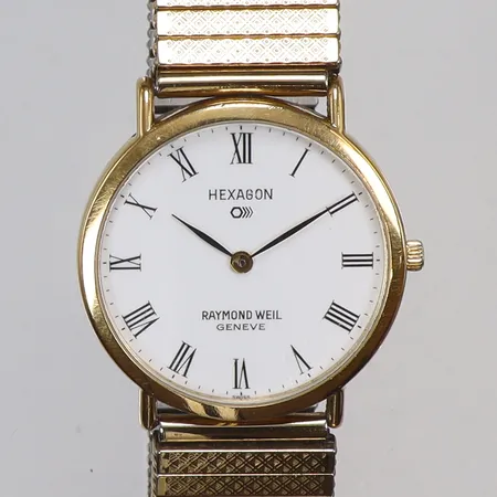 Damur Raymond Weil Hexagon Ø31mm boett nr. 5508-2, quartz (går ej, troligen batteribyte), guld på stål, repig boett och glas, flexlänk 